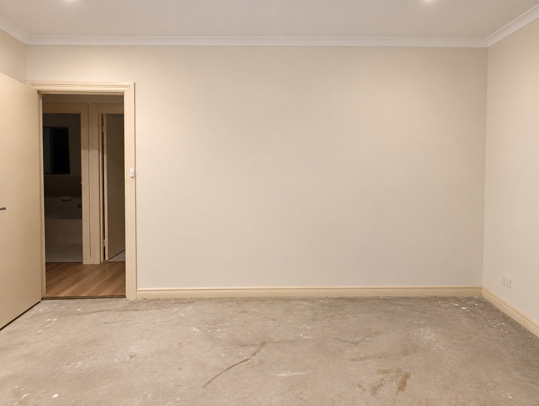 Bedroom wall before walk-in wardrobe installation